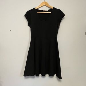 Cute black stretch dress with skater skirt